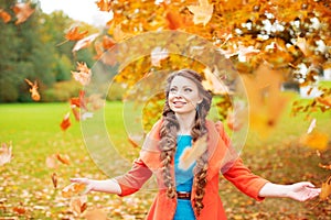 Autumn model, bright make up. woman on background fall landscape