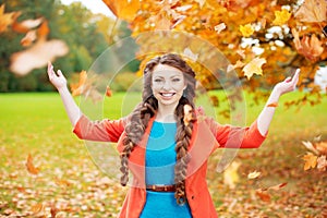 Autumn model, bright make up. woman on background fall landscape