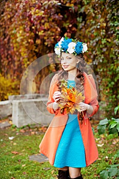 Autumn model, bright make up. woman on background fall landscape