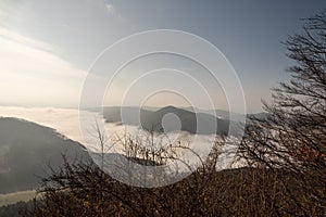 Autumn mountain landscape with mist on valleys, mountain ranges and blue sky in Slovakia