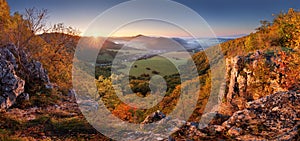 Autumn mountain panorama with golden forest and village in Slovakia