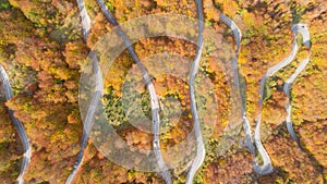 Autumn mountain zigzag road view from above