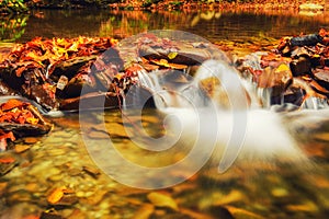 Autumn mountain waterfall