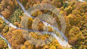 Autumn mountain zigzag road view from above