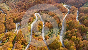 Autumn mountain zigzag road view from above