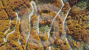 Autumn mountain zigzag road view from above