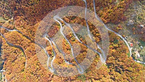 Autumn mountain zigzag road view from above