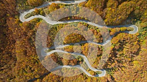 Autumn mountain zigzag road view from above