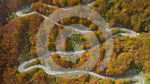 Autumn mountain zigzag road view from above