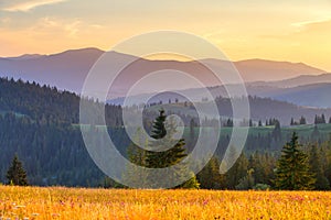 Autumn in mountains. Vivid mountain hills at the sunset.