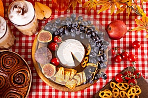 Autumn outdoor picnic set or dinner for celebration Thanksgiving Day. Holiday party. Festive table. Snacks, fruits, pie,