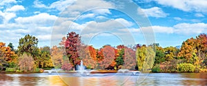 Autumn panorama pond and trees in park