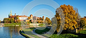 Autumn panorama of Wawel castle with Vistula and trees