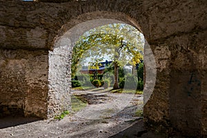 Autumn park through an archway