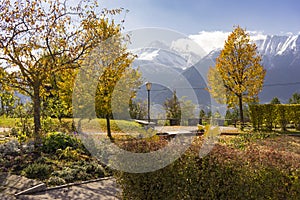 Autumn park overlooking the Austrian alps