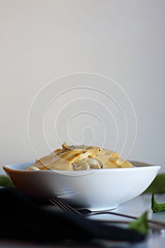 Autumn pasta with pumpkin cream and pepper.