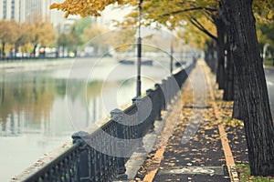 Autumn path by urban river