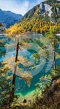 Autumn peaceful alpine lake Braies or Pragser Wildsee. Fanes-Sennes-Prags national park, South Tyrol, Dolomites Alps, Italy,