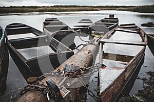 Autumn pier with old wooden boats