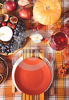 Autumn place setting dinner for celebration Thanksgiving Day. Holiday party. Festive table. Snacks, friuts,pie, pumpkin,