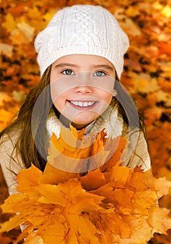 Autumn portrait of adorable little girl in hat