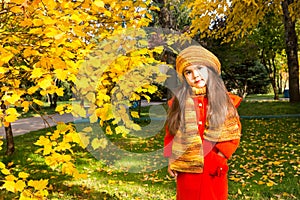 Autumn portrait of beautiful kazakh, asian child. Happy little girl with leaves in the park in fall.