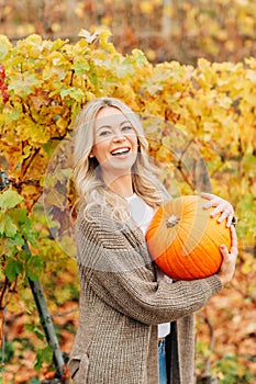 Autumn portrait of beautiful woman with blond hair