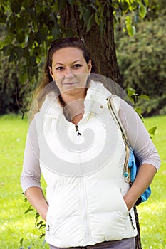 Autumn portrait of charming woman outdoors