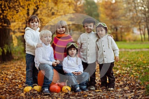 Autumn portrait of group of happy kids, outdoor