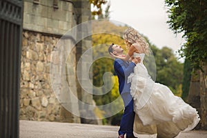 Autumn portrait of happy wedding couple.