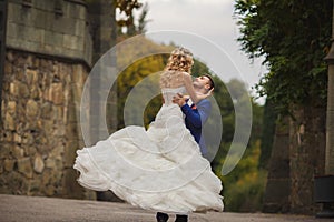 Autumn portrait of happy wedding couple.