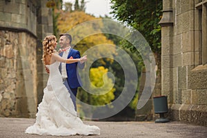 Autumn portrait of happy wedding couple.