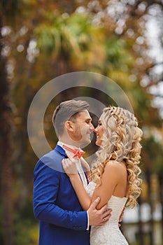 Autumn portrait of happy wedding couple.