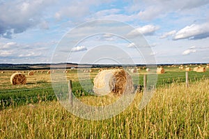 Autumn prairie and straw piles