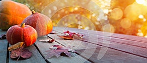 Autumn pumpkin on wooden table; thanksgiving holiday party background