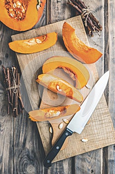 Autumn pumpkins and leaves on a wooden table.Autumn pumpkin thanksgiving background with pumpkins.Halloween.Thanksgiving