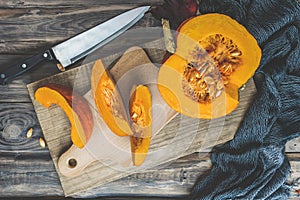 Autumn pumpkins and leaves on a wooden table.Autumn pumpkin thanksgiving background with pumpkins.Halloween.Thanksgiving