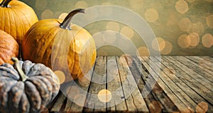 Autumn pumpkins still life on vintage wooden table and rustic background. Thanksgiving family dinner greeting card design.