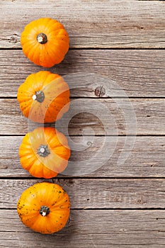 Autumn pumpkins on wooden table