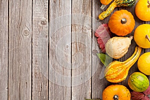 Autumn pumpkins on wooden table