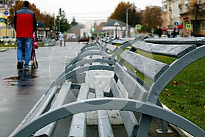 Bench in the park is empty in autumn