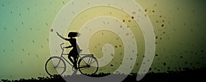 Autumn rain, girl riding on the bicycle and autumn leaves swirling and rain started, silhouette,