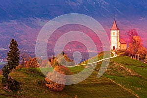 Sunset with church on top of hill, Slovenia