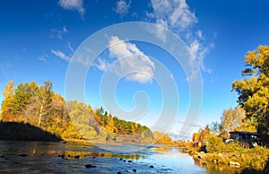 The autumn river of Miass is below the Shershnevskaya dam.