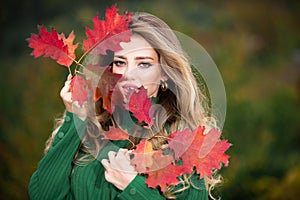 Autumn romance woman with leaves. Female model on foliage day. Dream and lifestyle. Beauty outdoor portrait. Carefree