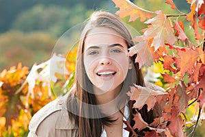 Autumn romance woman with leaves. Female model on foliage day. Dream and lifestyle. Beauty outdoor portrait. Carefree