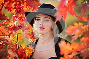 Autumn romance woman with leaves. Female model on foliage day. Dream and lifestyle. Beauty outdoor portrait. Carefree