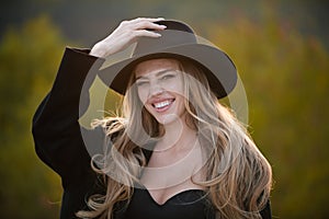 Autumn romantic casual woman portrait. Beautiful happy smile girl in wide broad brim hat outdoor, close up beauty young