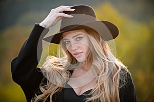 Autumn romantic casual woman portrait in fashion brim black hat. Beautiful girl outdoor, close up beauty young female