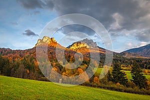 Autumn rural landscape with mountains peaks on background